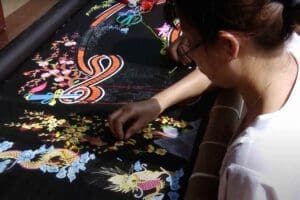 A woman doing a embroidery in one of the village in Vietnam