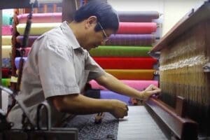 A worker doing a Silk in one of the Silk Village at Vietnam