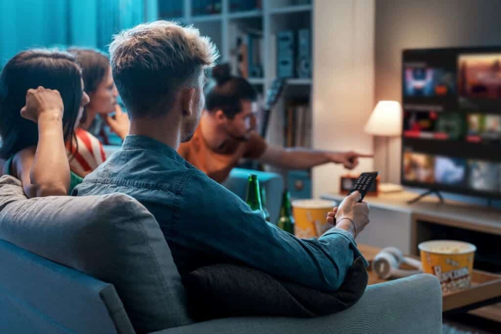 Group of young people watching on netflix