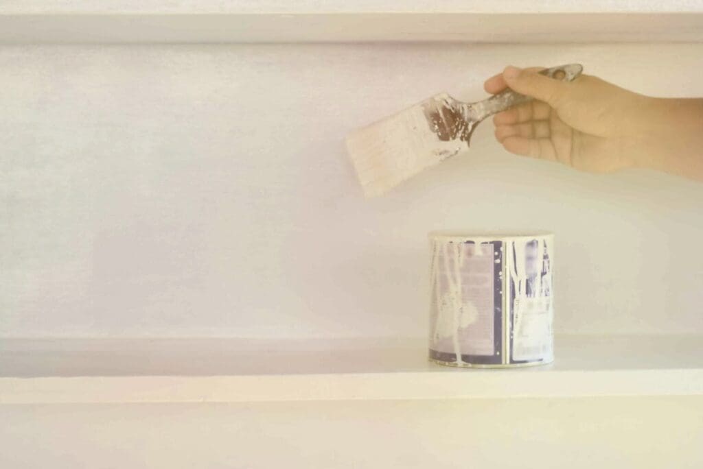 Applying Enamel Paint On The Cabinet