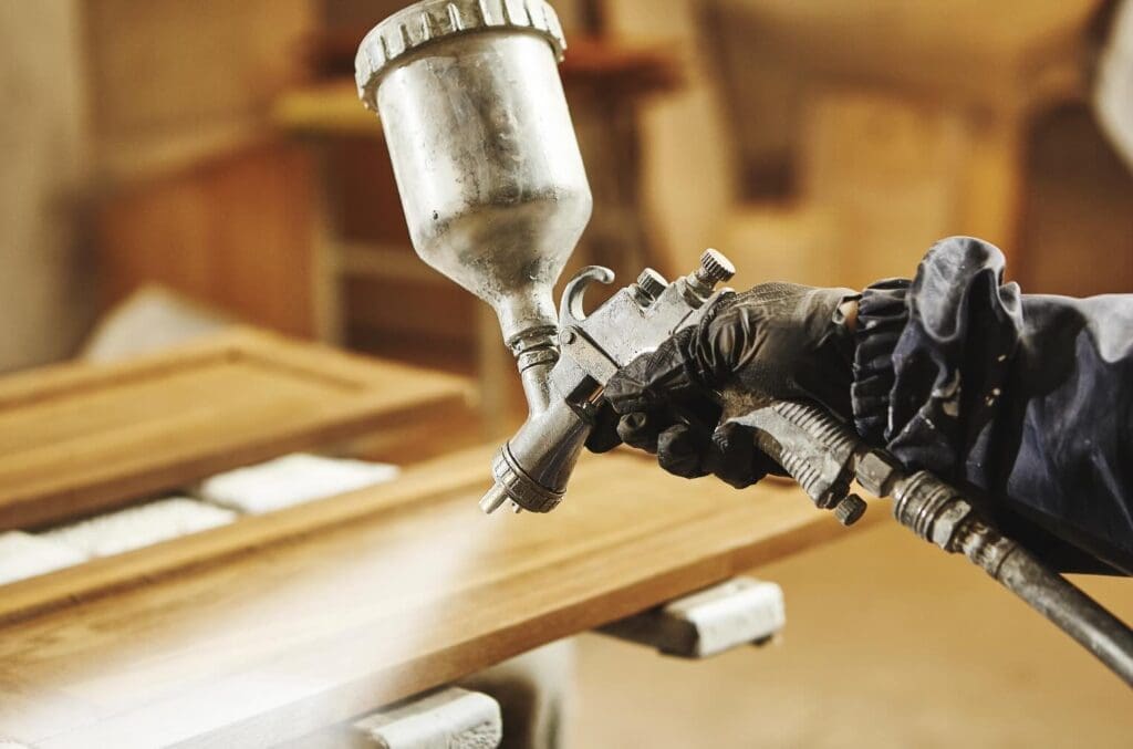 Spraying Lacquer Into Cabinet