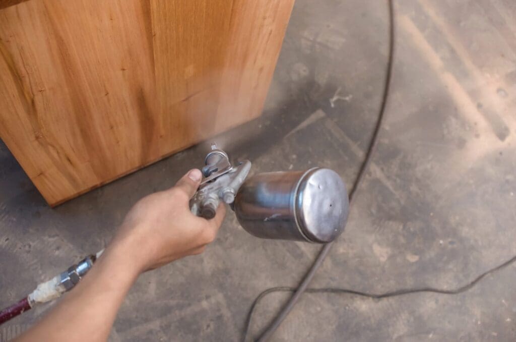 Spraying Lacquer Into Cabinets